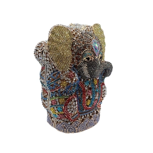 Macro detail of multi-colored rhinestone elephant evening clutch with ethnic patterns