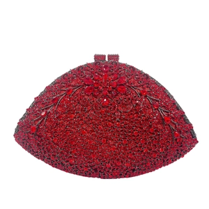Macro shot of red rhinestone floral evening clutch with crystal vine and jewel details