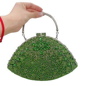 Detailed view of green crystal evening clutch with floral pattern and silver metal handle