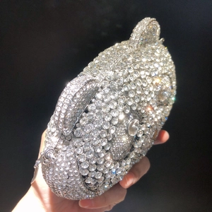 Detailed view of luxury bear shaped clutch bag fully encrusted with sparkling crystals
