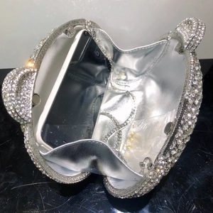 Detailed interior of bear-shaped diamond evening clutch bag showing phone storage capacity
