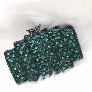Green glitter evening clutch with crystal leaf patterns and black butterfly clasp