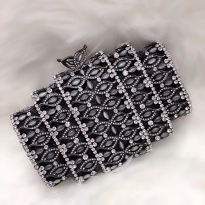 Luxe black clutch bag with silver rhinestones, cat-eye stones and butterfly clasp