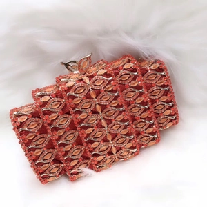 Luxury red crystal evening clutch bag with gold butterfly clasp and floral diamond pattern
