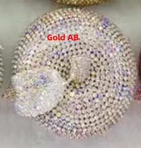 Macro shot of Gold AB rhinestones on an apple-shaped evening clutch bag