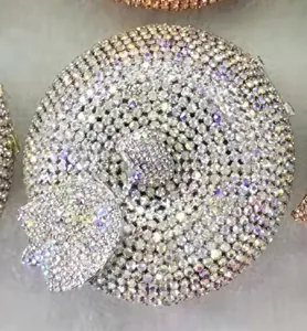 Detail of silver AB crystal encrusted apple clutch bag showing shimmering rhinestones