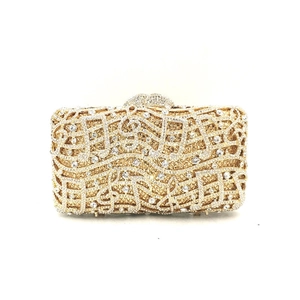 Detailed close-up of musical note crystal clutch bag with gold and silver rhinestones