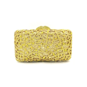Macro shot of musical note crystal pattern on evening clutch bag with metal clasp