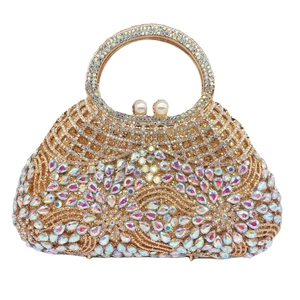 Detailed view of rhinestone evening bag with pearly clasp and sparkling crystal accents