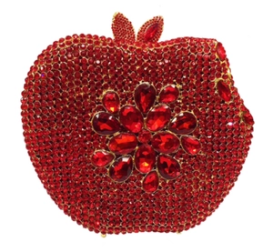 Detail of apple shaped evening clutch featuring red crystals and flower gemstone design
