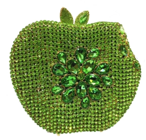 Close-up of green rhinestone apple clutch with a crystal flower pattern and leaf clasp