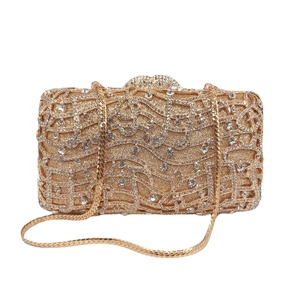 Golden musical note evening clutch bag with white crystal rhinestones and chain