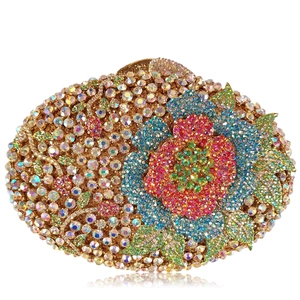 Pochette ovale ornée de fleurs en strass colorés avec monture en métal doré