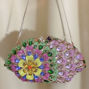 Macro shot of luxury evening clutch bag featuring colorful floral crystal pavé pattern