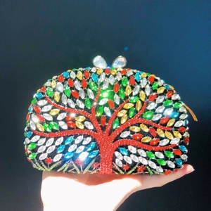 Luxurious evening clutch bag featuring colorful rhinestones and a red tree of life design