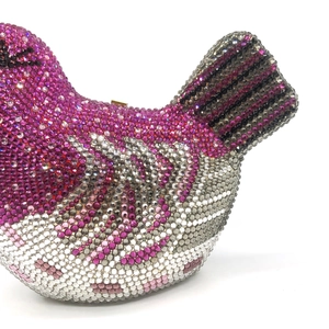 Macro view of pink and silver crystal bird clutch bag showing detailed feather texture