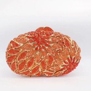 Detail of red and orange floral rhinestone pattern on an oval evening clutch bag