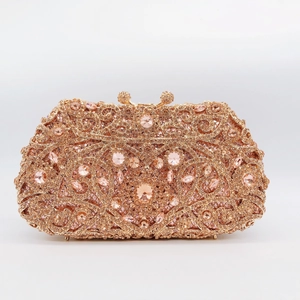 Detailed macro view of rose gold evening clutch bag with pink crystals and rhinestones