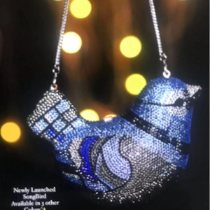 Elegant bird shaped evening clutch bag with blue and silver rhinestones and chain strap