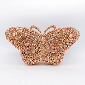 Macro view of butterfly evening clutch bag showing intricate champagne gold rhinestones