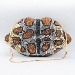 Macro view of crystal encrusted leopard print lip clutch bag with gold chain strap
