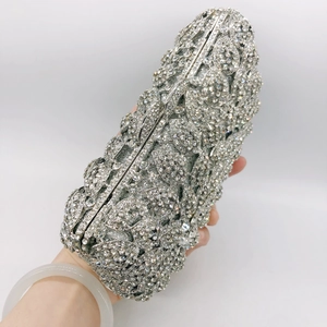 Elegant silver stone clutch bag with intricate rhinestone vine patterns for evening wear