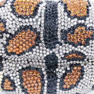 Macro shot of hand-set leopard print rhinestones on this luxury dinner clutch bag