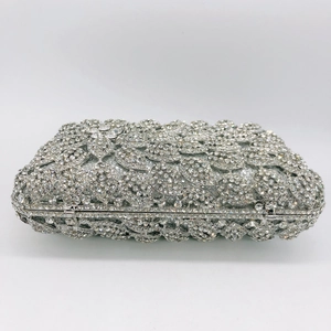 Macro detail of silver rectangular stone clutch showing wave-patterned crystal inlay
