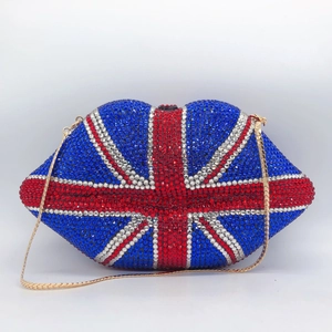 Macro detail of lip-shaped clutch bag with sparkling British flag rhinestones and gold chain