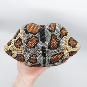 Close-up of leopard print lip clutch bag featuring sparkling rhinestone inlay