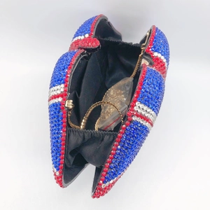 Red white and blue rhinestone lips clutch bag with a gold chain strap inside