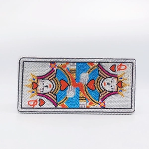 Detailed view of Queen of Hearts pattern crafted with vibrant rhinestones on the clutch bag