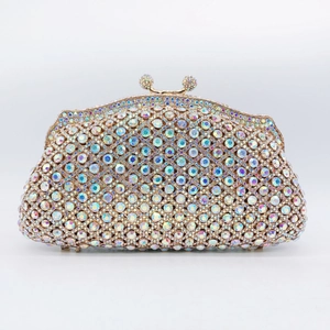 Macro shot of luxury clutch bag featuring rainbow AB rhinestones and gold metal frame