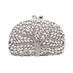 Elegant silver clutch bag with hollow tree design and shimmering rhinestone crystal inlay