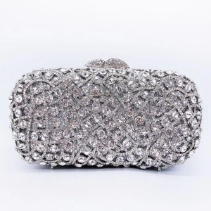 Detailed close-up of hollowed-out silver evening clutch bag with sparkling rhinestones