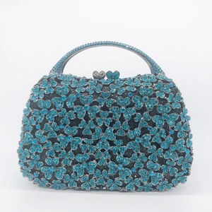 Luxury oval evening clutch with sky blue rhinestone flower pattern and heart clasp