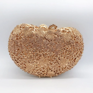 Elegant gold heart-shaped clutch bag with sparkling rhinestones for formal evening events