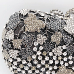 Macro detail of grapevine leaf pattern with hand-set grey and black rhinestones