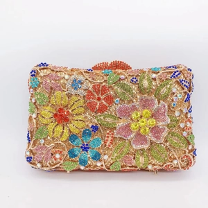 Detailed close-up of a luxury crystal evening clutch with colorful floral rhinestone patterns