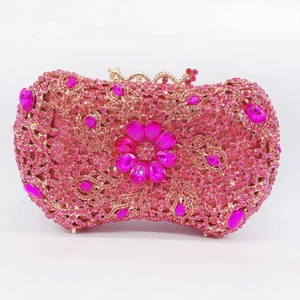 Macro detail of luxury rose pink rhinestone clutch bag with crystal floral pattern