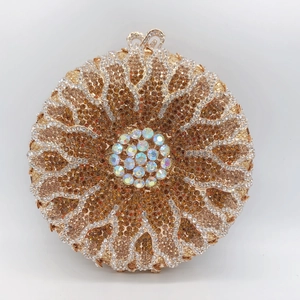 Detailed macro view of amber and gold rhinestones on floral circular evening clutch bag