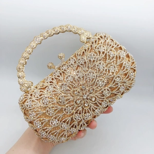 Luxurious champagne gold floral evening clutch with crystals and round ring handle