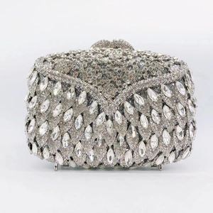 Macro detail of silver marquise and round rhinestone patterns on evening clutch bag