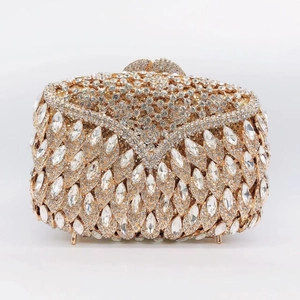 Detailed shot of luxurious gold clutch bag with marquise crystals and rhinestones