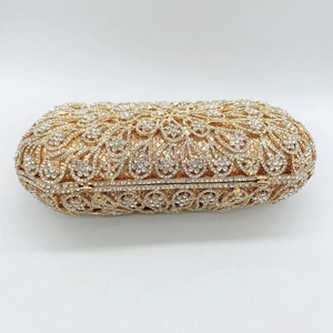 Macro detail of golden phoenix floral evening clutch featuring sparkling rhinestones
