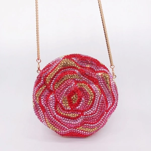Macro shot of circular clutch featuring colorful rose pattern rhinestones and gold chain