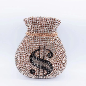 Macro shot of money bag evening clutch featuring sparkling rhinestones and dollar sign