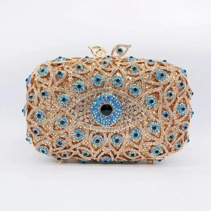 Detailed view of Evil Eye evening clutch featuring hand-set blue and gold rhinestones