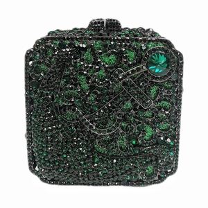 Detail of green and black rhinestone evening clutch bag with emerald-cut jewel accent