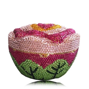 Macro detail of luxury floral round clutch bag with colorful rhinestones and metal frame
